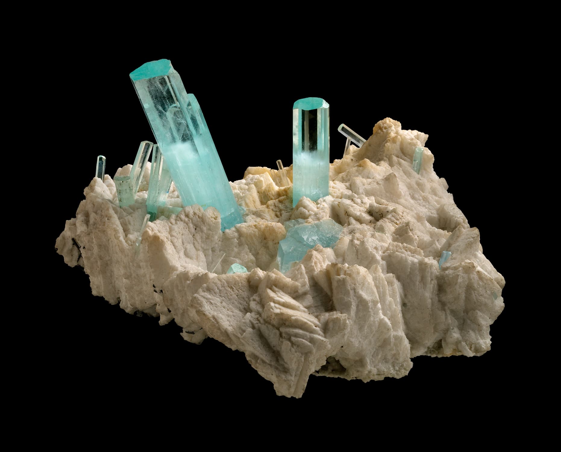 Natural aquamarine crystals in white Albite Feldspar matrix, from the Gilgit district, Pakistan. Length of largest crystal is 70 mm